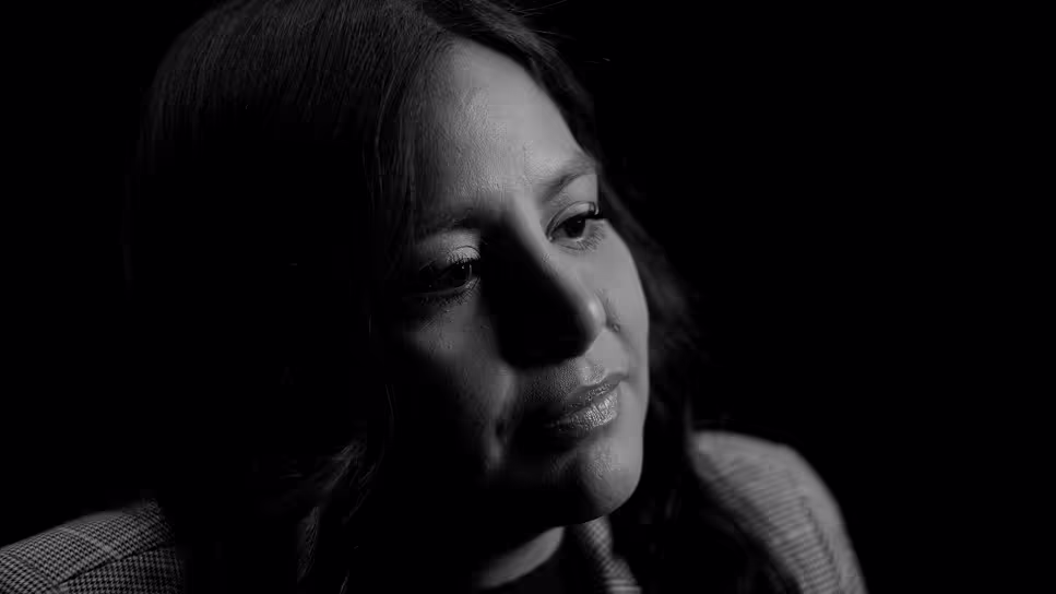 A picture of Maria in front of a black background